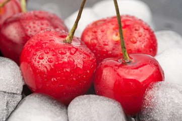 Cherries and ice cubes with drops