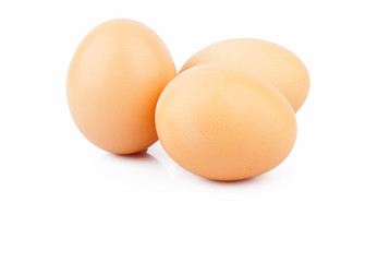 Chicken raw eggs, whole and broken on white, food photo