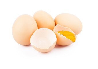 Chicken raw eggs, whole and broken on white, food photo