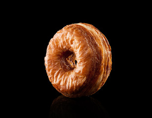 Croissant and doughnut mixture isolated on black