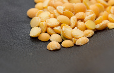 peas on a black background. macro
