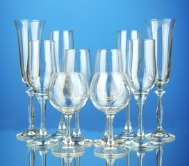 Collection of wine glasses, on blue background