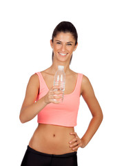 Attractive brunette girl drinking water during training