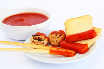 Rusks with sesame seeds, bread sticks and sauce