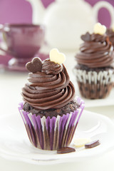 Chocolate muffins with chocolate cream.