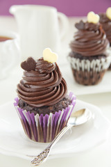 Chocolate muffins with chocolate cream.