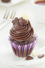Chocolate muffins with chocolate cream.