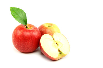 Fresh red apples with a slice isolated on white background.