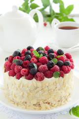 Sponge cake with cream and raspberries.
