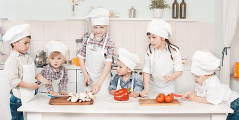 young chef preparing vegetables in the kitchen