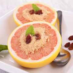 Naklejka na ściany i meble grapefruit with sugar and raisin