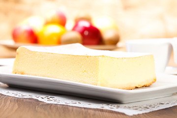 The composition of delicious cheesecake served with strawberries