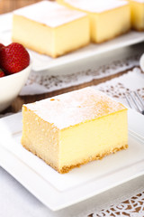The composition of delicious cheesecake served with strawberries