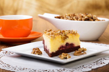 Cheesecak with a cap of coffee or tea