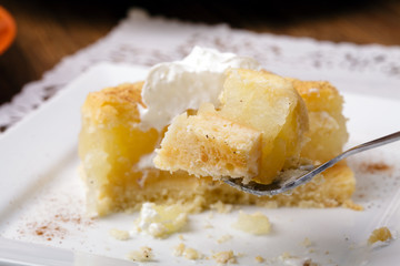 Delicious apple pie with whipped cream (eating cake)