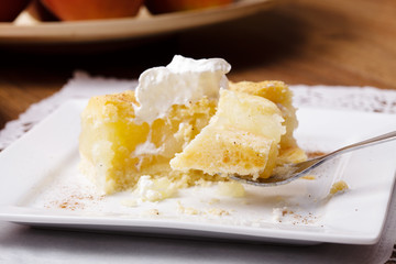 Delicious apple pie with whipped cream (eating cake)