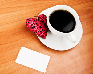 Red straw heart and cup of coffee