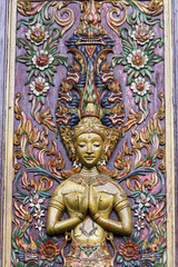 Fototapeta na wymiar Carving on wood door in thailand