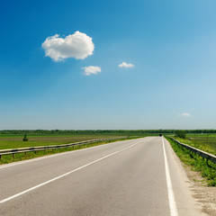 asphalt road to horizon under blue sky