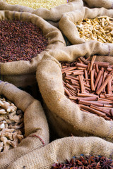 Cinnamon and other spices in the bags at Indian market