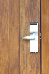 Modren style door handle on natural wooden door