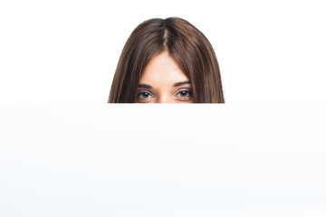 Portrait of a young woman with blank billboard