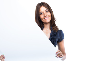 Portrait of a young woman with blank billboard