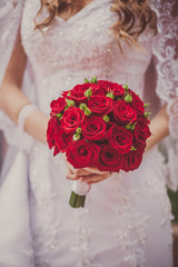 Wedding bouquet of flowers held by a bride