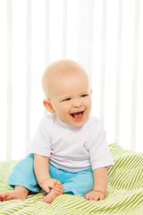 Fototapeta premium Baby laugh in his crib