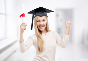 student in graduation cap with certificate