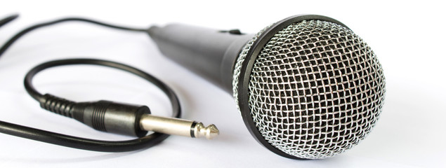 Microphone with black wire isolated on white