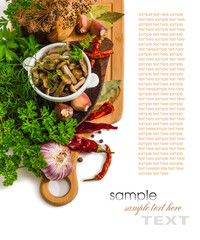 Marinated mushrooms in a cup on the background of spices
