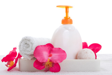 Obraz na płótnie Canvas Hand soap, towel and pink orchid
