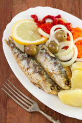 fried sardines on white dish