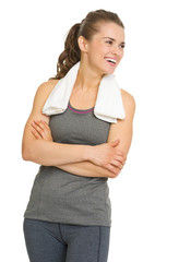 Fototapeta premium Portrait of happy fitness young woman looking on copy space