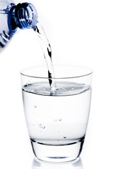 filling a glass with water trough blue bottle