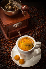 Espresso cup with coffee mill