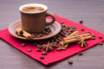 Cup of Coffee with Spices on Red Napkin