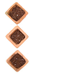 Terracotta or clay gardening pots with dirt