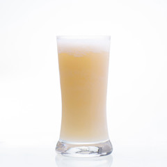 Apple juice smoothie shake in glass isolated