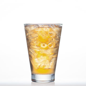Bael tea Thai drinks style with ice in glass isolated
