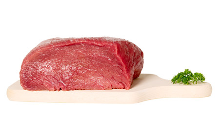 Raw sliced meat on cutting board