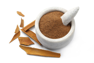 Cinnamon with Powder in a ceramic Bowl