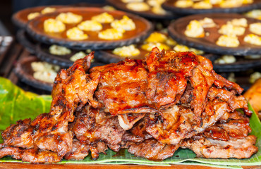 Grilled pork for sale in street market of Thailand