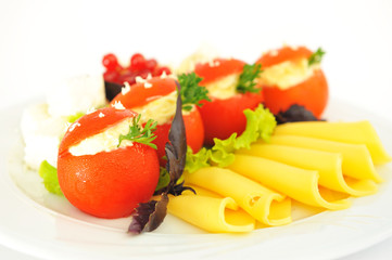 Tomatoes stuffed with cheese.
