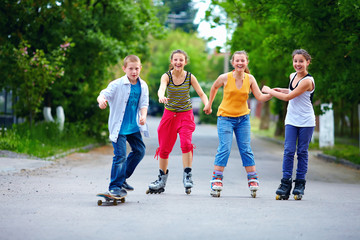 happy teenage friends playing outdoors © Olesia Bilkei