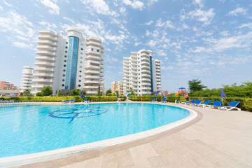 Residence with swimming pool on background of sky