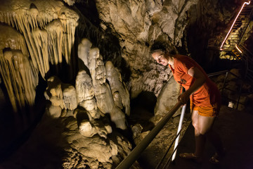 A girl enjoys the view of the old cave