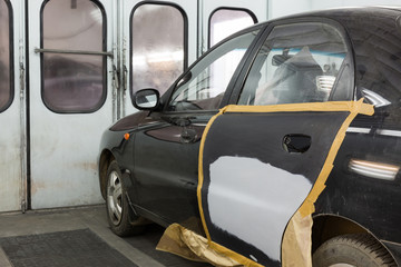 Preparing the car for painting on body shop