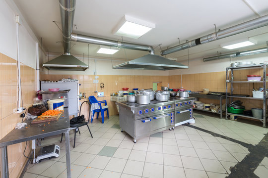 Large kitchen of the restaurant with different kitchenware